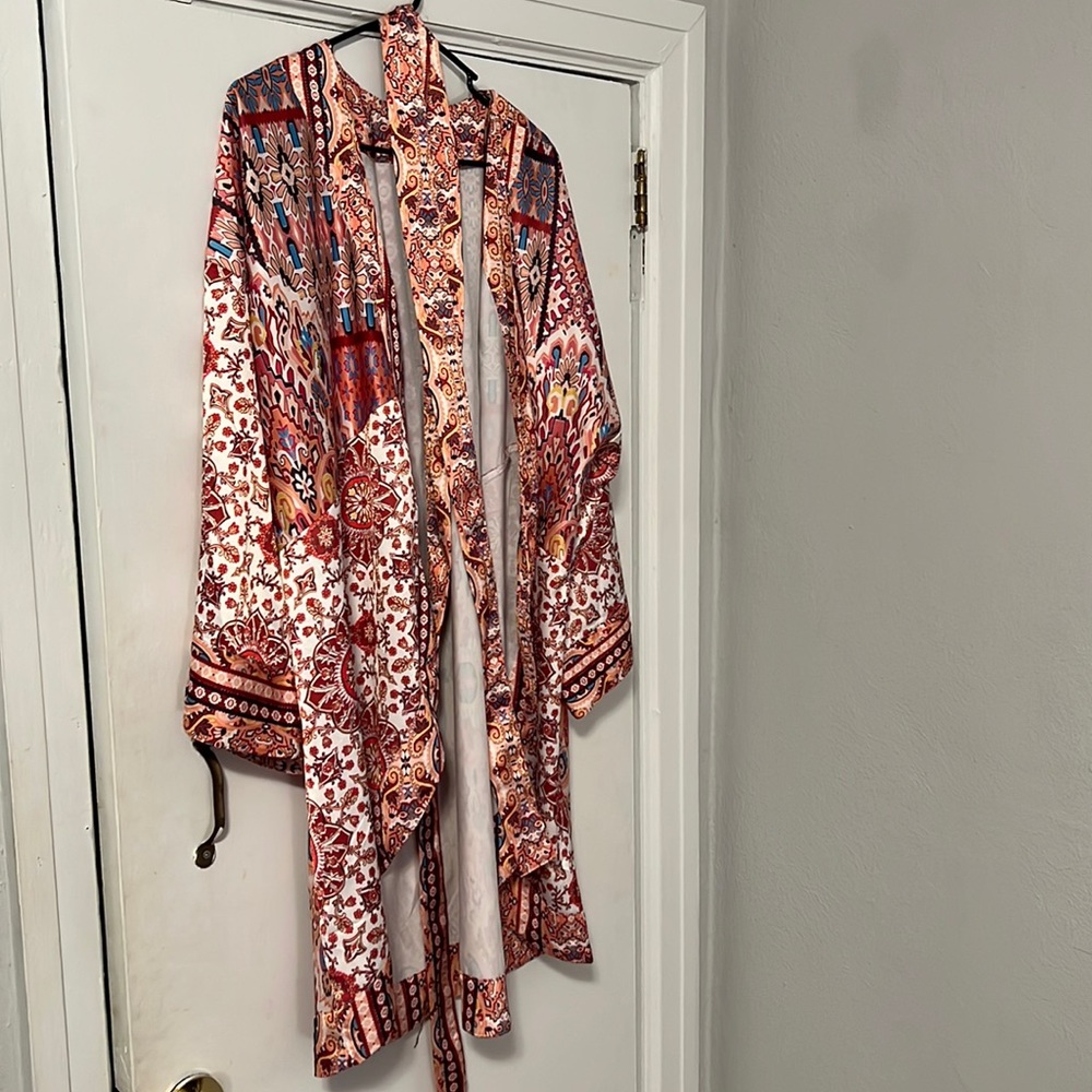 Multicolored floral wrap/jacket with belt.